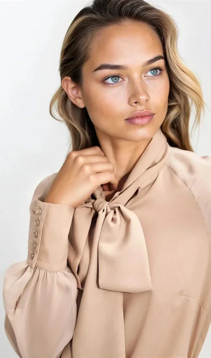 Delicate beige blouse with sash